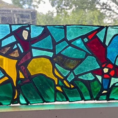 Three stained glass window panels