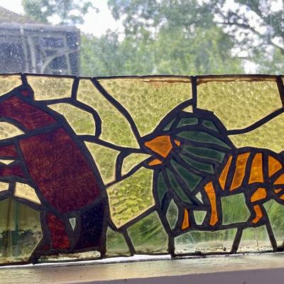 Three stained glass window panels