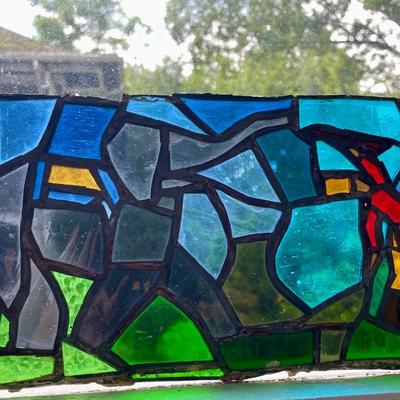 Three stained glass window panels