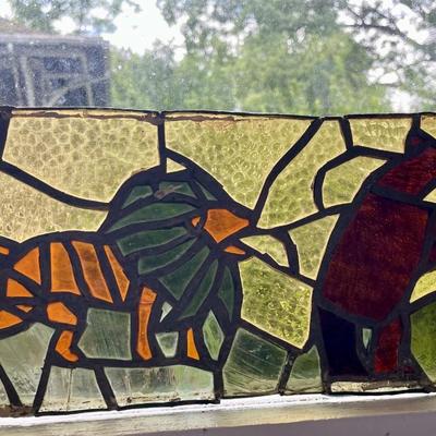 Three stained glass window panels