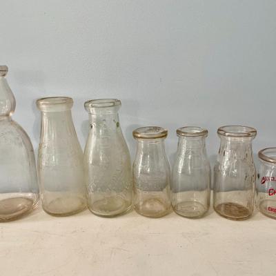 Lot of 7 vintage milk bottles