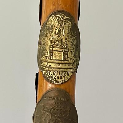 Pair of antique German Alpine walking canes with badges