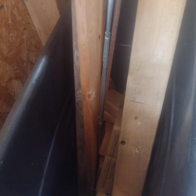 Pair of Composite Trash Receptacles and Wood Remnants