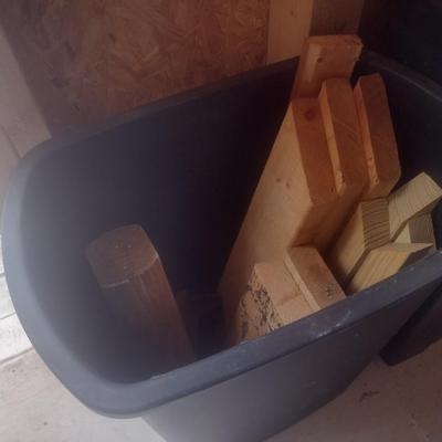 Pair of Composite Trash Receptacles and Wood Remnants