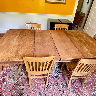 Antique tiger oak expandable claw-foot table & 6 oak chairs