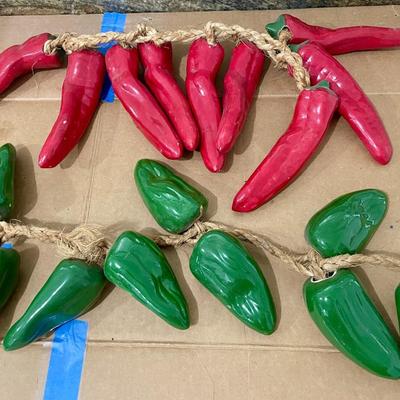 Two strings of ceramic peppers