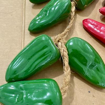 Two strings of ceramic peppers