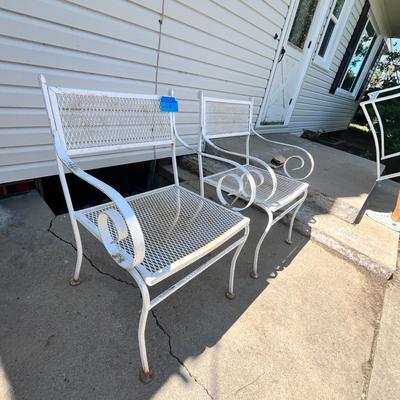 Lot 638 White metal patio chairs