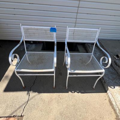Lot 638 White metal patio chairs