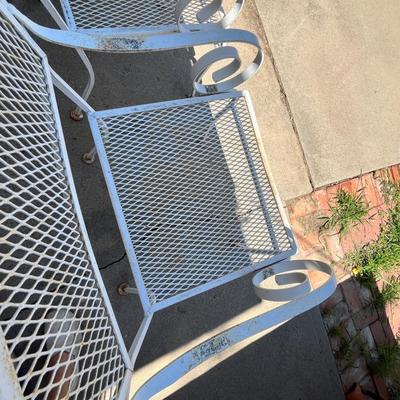 Lot 638 White metal patio chairs