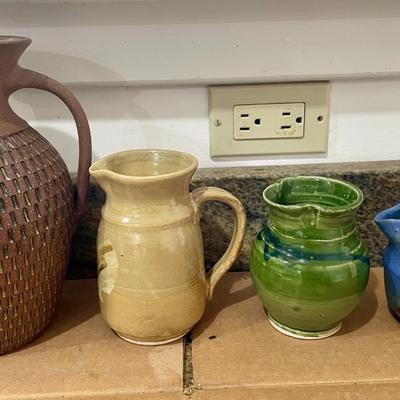 Lot of 4 hand-thrown pottery pitchers & creamers + hand-thrown loaf pan