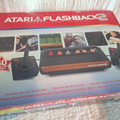 Sale Photo Thumbnail #159: This is a flashback2  not an original atari  does not require a RF box but does connect through AV cables so you still need an older TV with an AV input.  Looks to be new in box. 