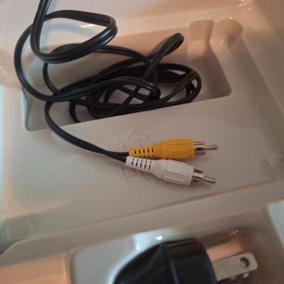 Sale Photo Thumbnail #157: This is a flashback2  not an original atari  does not require a RF box but does connect through AV cables so you still need an older TV with an AV input.  Looks to be new in box. 