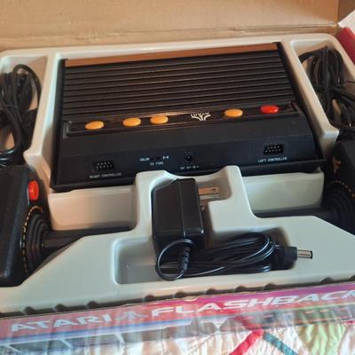 Sale Photo Thumbnail #156: This is a flashback2  not an original atari  does not require a RF box but does connect through AV cables so you still need an older TV with an AV input.  Looks to be new in box. 