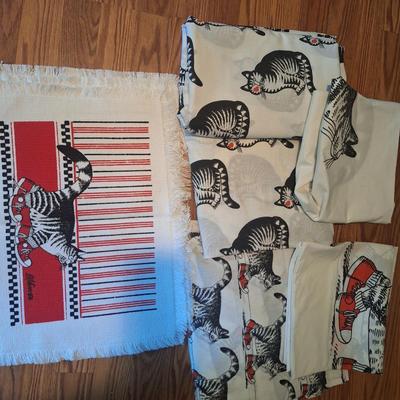 Sale Photo Thumbnail #194: These don't appear to have ever been used however the elastic in both fitted sheets are crumbly and wouldn't work well.  There are two sheet sets, one with the sitting cat and one with the cat wearing red shoes.  Both sets have the pillowcase as cat with 