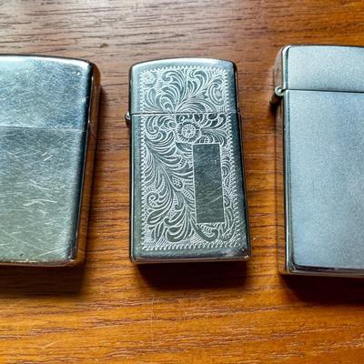 Pair of vintage Zippo + Scripto butane lighters