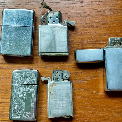 Pair of vintage Zippo + Scripto butane lighters