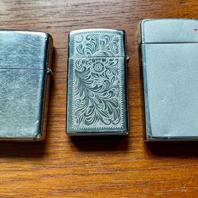 Pair of vintage Zippo + Scripto butane lighters