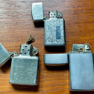 Pair of vintage Zippo + Scripto butane lighters