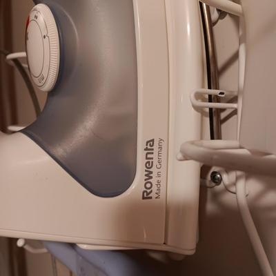 ROWENTA PROFESSIONAL CLOTHES IRON, IRONING BOARD AND A WALL MOUNTED HOLDER