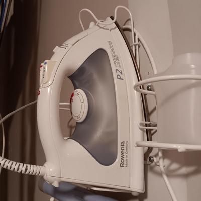 ROWENTA PROFESSIONAL CLOTHES IRON, IRONING BOARD AND A WALL MOUNTED HOLDER