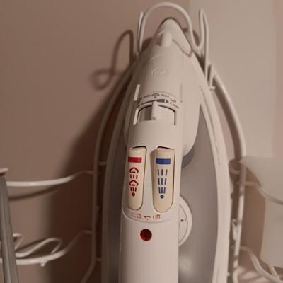 ROWENTA PROFESSIONAL CLOTHES IRON, IRONING BOARD AND A WALL MOUNTED HOLDER