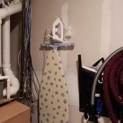 ROWENTA PROFESSIONAL CLOTHES IRON, IRONING BOARD AND A WALL MOUNTED HOLDER