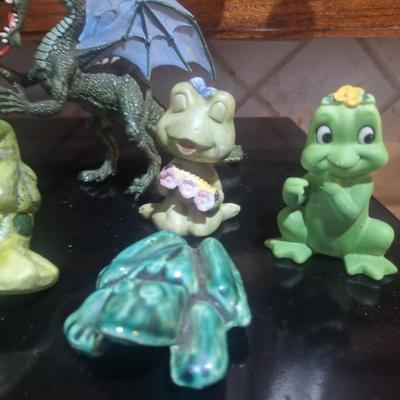 Sale Photo Thumbnail #357: a basket, ceramic or pottery frogs and a plastic dragon