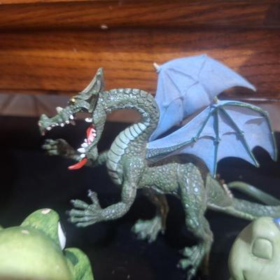 Sale Photo Thumbnail #359: a basket, ceramic or pottery frogs and a plastic dragon