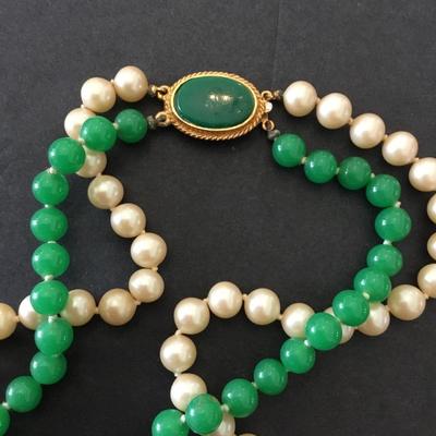 Beautiful, vintage hand knotted art, deco, green glass or jade type faux pearl necklace. Very beautiful very nice.