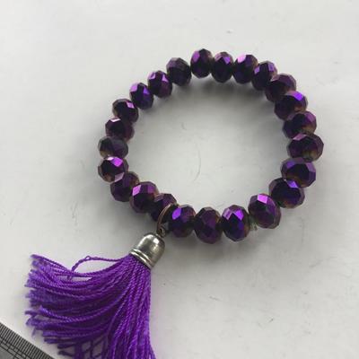 Purple stretchy beaded tassel bracelet