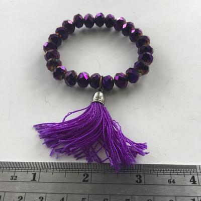 Purple stretchy beaded tassel bracelet