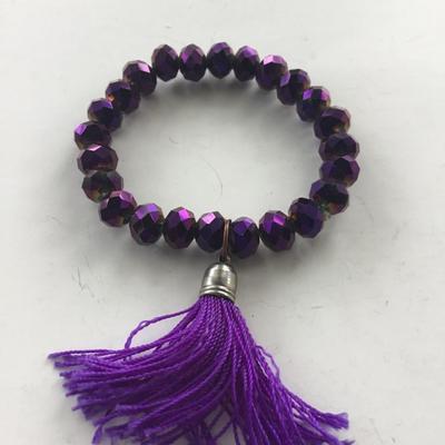 Purple stretchy beaded tassel bracelet