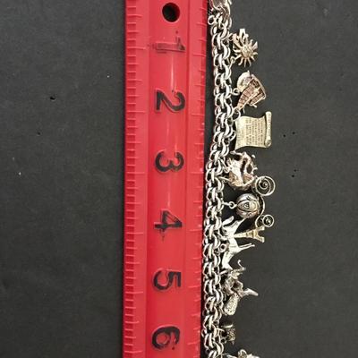 Beautiful vintage rhythm 925 sterling silver charm bracelet very nice very beautiful all sterling silver tested