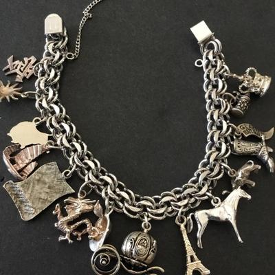 Beautiful vintage rhythm 925 sterling silver charm bracelet very nice very beautiful all sterling silver tested
