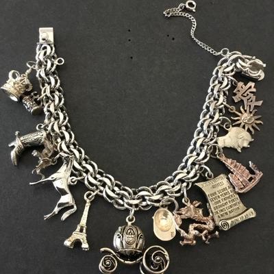 Beautiful vintage rhythm 925 sterling silver charm bracelet very nice very beautiful all sterling silver tested