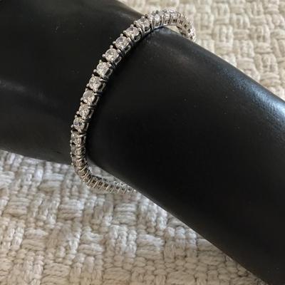 Silver tone bracelet with authentic crystal