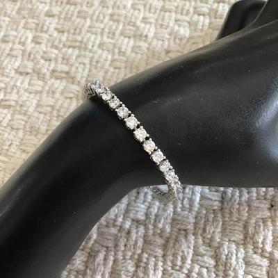 Silver tone bracelet with authentic crystal