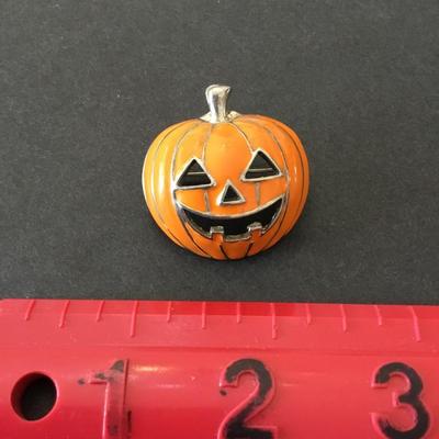 Super cute enamel pumpkin brooch