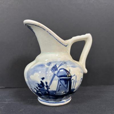 LOT 104: McCoy Dutch Shoe Planters, Delft Blue Pitcher, Ceramic Art Studio Wee Dutch Boy & Girl Salt/Pepper Shakers