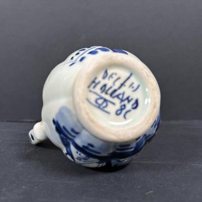 LOT 104: McCoy Dutch Shoe Planters, Delft Blue Pitcher, Ceramic Art Studio Wee Dutch Boy & Girl Salt/Pepper Shakers
