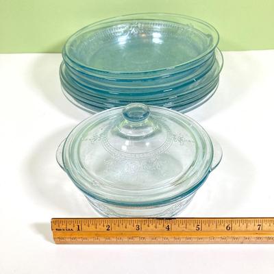 LOT 179: Large Fire King Oven Glass Collection - 2 Racks with Custard Cups, Plates, Small Lidded Bowls and Individual Custard Cups