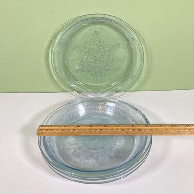 LOT 179: Large Fire King Oven Glass Collection - 2 Racks with Custard Cups, Plates, Small Lidded Bowls and Individual Custard Cups