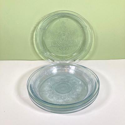 LOT 179: Large Fire King Oven Glass Collection - 2 Racks with Custard Cups, Plates, Small Lidded Bowls and Individual Custard Cups