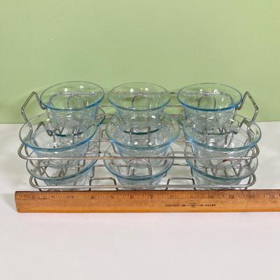 LOT 179: Large Fire King Oven Glass Collection - 2 Racks with Custard Cups, Plates, Small Lidded Bowls and Individual Custard Cups