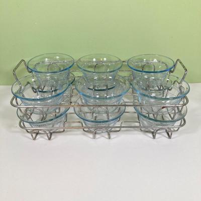 LOT 179: Large Fire King Oven Glass Collection - 2 Racks with Custard Cups, Plates, Small Lidded Bowls and Individual Custard Cups