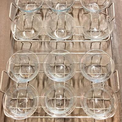 LOT 179: Large Fire King Oven Glass Collection - 2 Racks with Custard Cups, Plates, Small Lidded Bowls and Individual Custard Cups