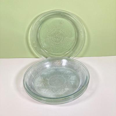 LOT 179: Large Fire King Oven Glass Collection - 2 Racks with Custard Cups, Plates, Small Lidded Bowls and Individual Custard Cups
