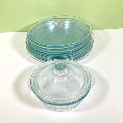 LOT 179: Large Fire King Oven Glass Collection - 2 Racks with Custard Cups, Plates, Small Lidded Bowls and Individual Custard Cups