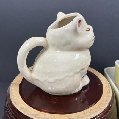 LOT 261: Hall for Westing House Refrigerator Dishes (no lids), Brown Glaze Bowl USA, Shawnee Cat Creamer, National Dairy Orange Juice...
